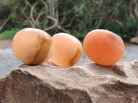 Polished Orange Twist Calcite Galets x 20 From Maevantanana, Madagascar