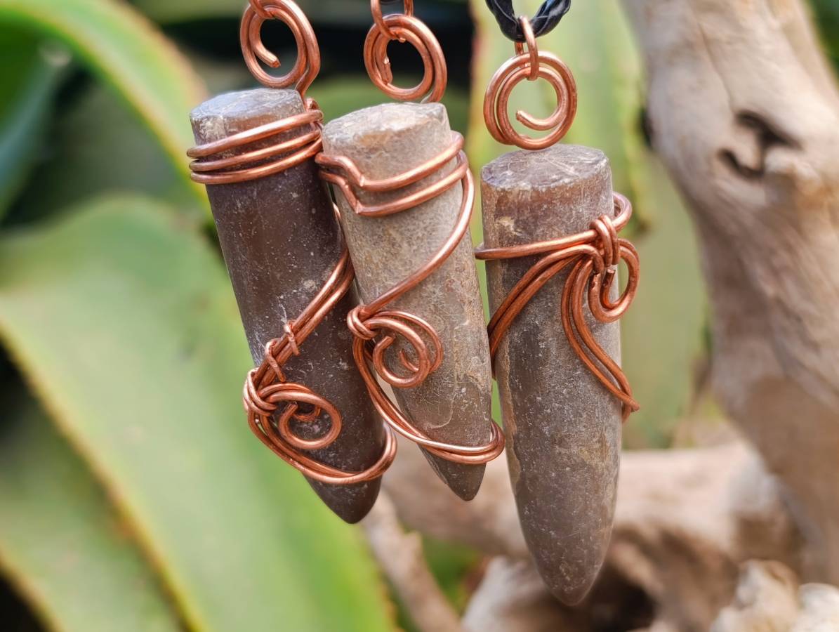 Natural Belemnite Fossil Bullet Copper Art Pendant With Plaited Cord - sold per piece - From Madagascar