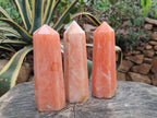 Polished Orange Twist Calcite Points x 3 From Maevantanana, Madagascar