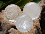 Polished Clear Smokey Quartz and Girasol Spheres x 12 From Madagascar