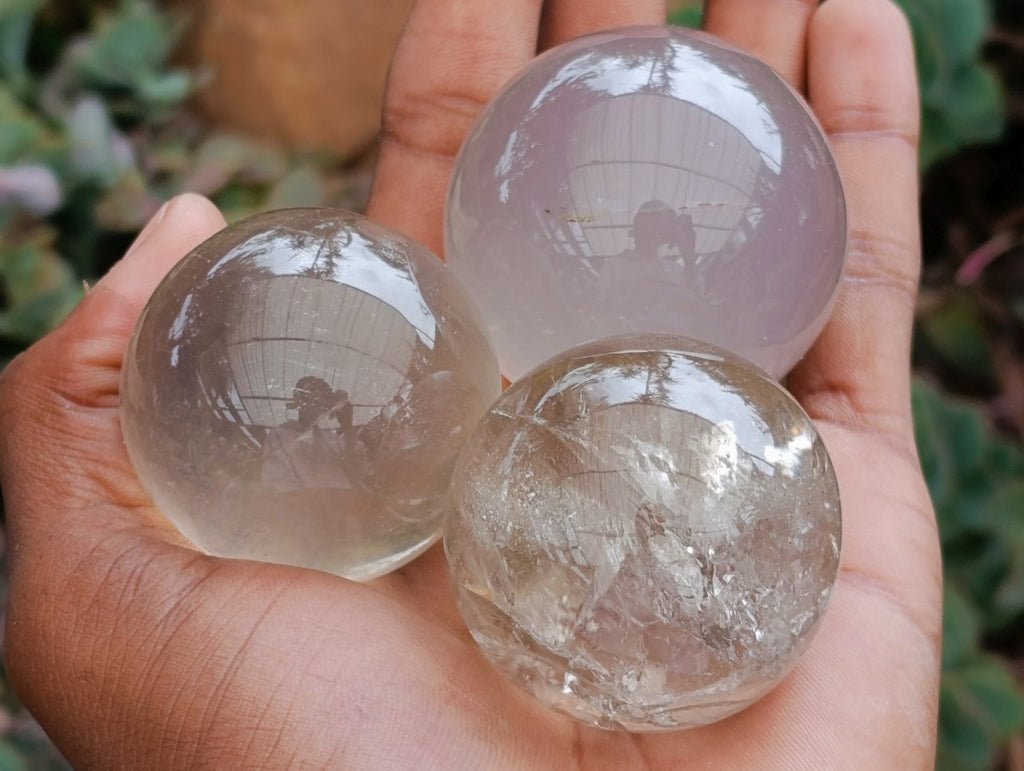Polished Clear Smokey Quartz and Girasol Spheres x 12 From Madagascar