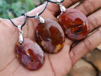 Hand Made Red Podocarpus Petrified Wood Mixed Shaped Pendants x 12 From Madagascar