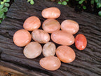 Polished Orange Twist Calcite Galets x 12 From Maevantanana, Madagascar - Toprock Gemstones and Minerals 