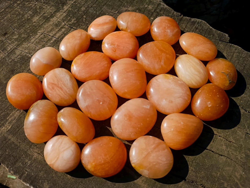 Polished Orange Twist Calcite Galets x 24 From Maevantanana, Madagascar