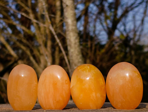 Polished Orange Twist Calcite Galets x 35 From Maevantanana, Madagascar