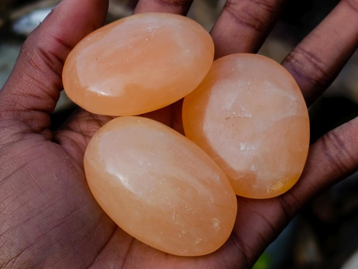 Polished Orange Twist Calcite Galets x 35 From Maevantanana, Madagascar