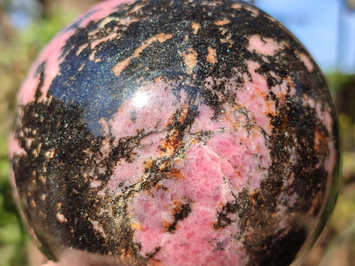 Polished Large Rhodonite Gemstone Sphere x 1 From Ambindavato, Madagascar
