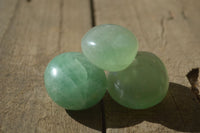 Polished Gemmy Emerald Fluorite Palm Stones  x 12 From Madagascar