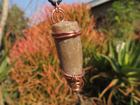 Polished Belemnite Bullet Fossil Rostrums In Copper Art Wire Wrap Pendant - sold per piece From Madagascar - TopRock