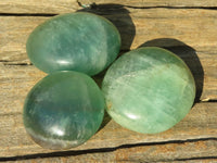 Polished Gemmy Emerald Fluorite Palm Stones  x 12 From Mandrosonoro, Madagascar