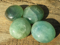 Polished Gemmy Emerald Fluorite Palm Stones  x 12 From Mandrosonoro, Madagascar