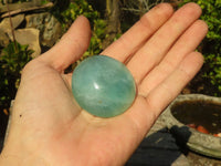 Polished Gemmy Emerald Fluorite Palm Stones  x 12 From Mandrosonoro, Madagascar