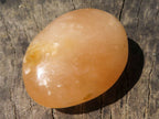 Polished Vibrant Orange Twist Calcite Palm Stones  x 12 From Madagascar - TopRock