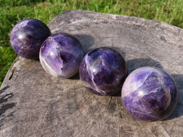 Polished Chevron Amethyst Spheres x 4 From Zambia - TopRock